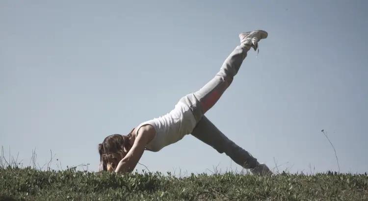 Woman stretching out in nature