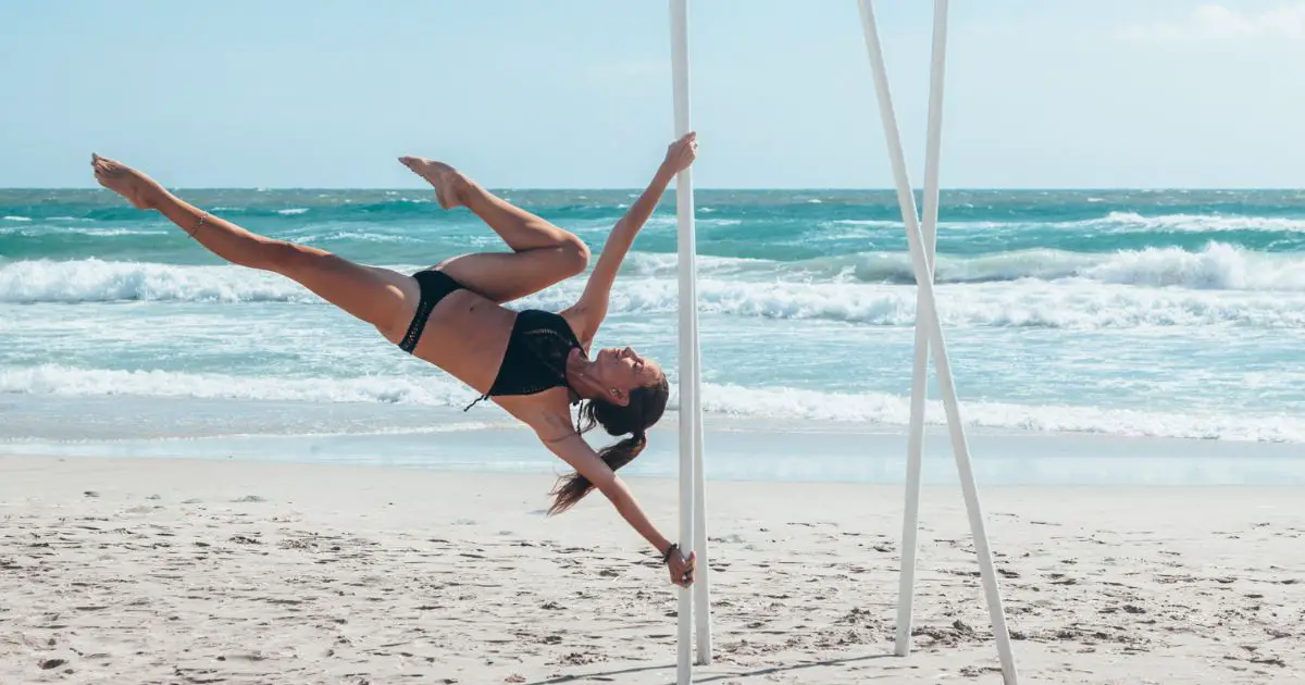 Eco-Friendly Pole Dancing - dancing on the beach